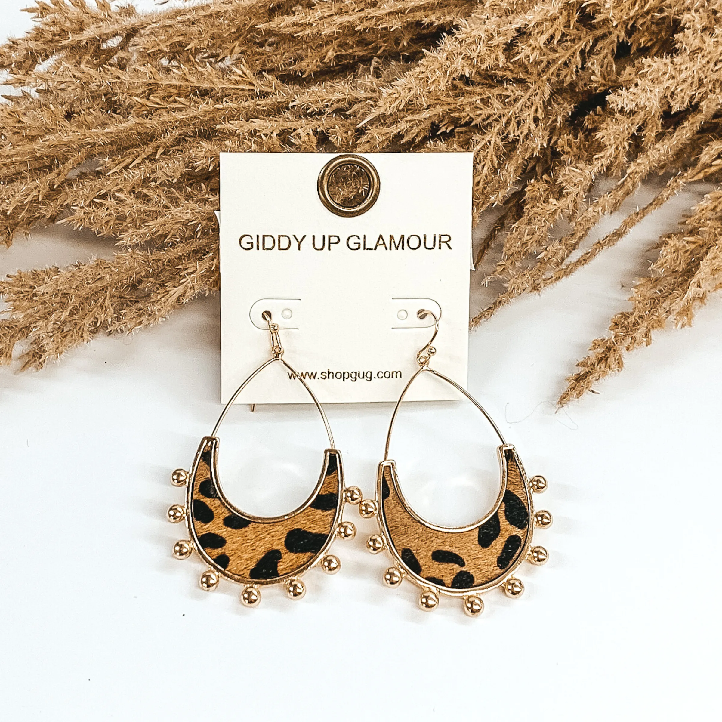 Gold Teardrop Earrings with a Brown Animal Print